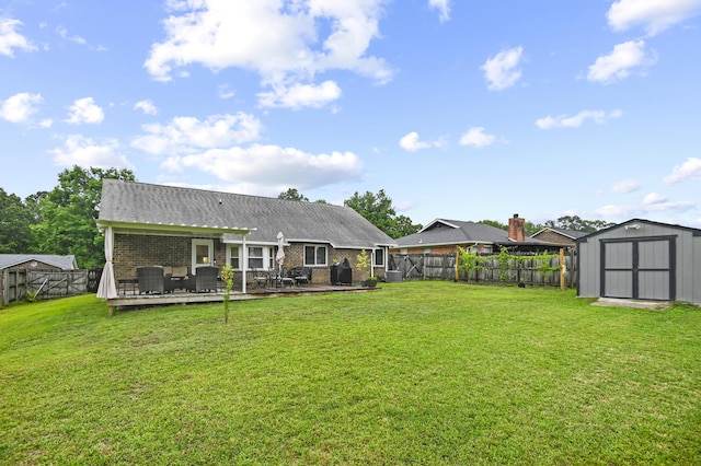 back of house featuring a storage shed, an outdoor structure, a wooden deck, and brick siding