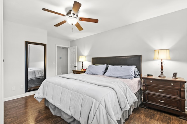 bedroom with dark wood-type flooring, baseboards, and a ceiling fan