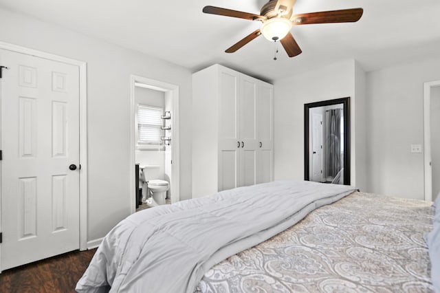 bedroom featuring dark wood-type flooring, connected bathroom, and ceiling fan