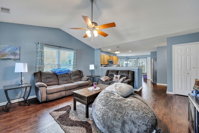 living room featuring ceiling fan, lofted ceiling, and dark hardwood / wood-style flooring