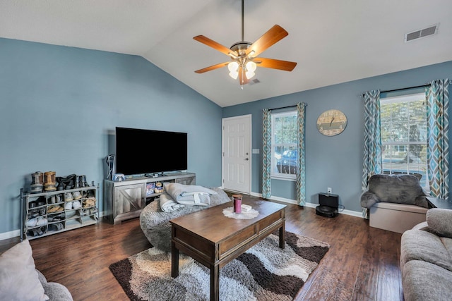 living room featuring ceiling fan, plenty of natural light, dark hardwood / wood-style flooring, and vaulted ceiling