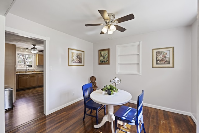 127 Ridge Rd, Summerville, SC 29485 - dining room with dark hardwood / wood-style flooring, ceiling fan, sink, and built in features