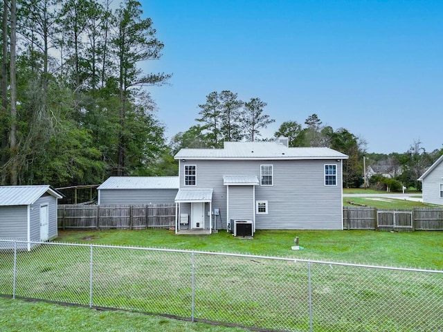 49 Auld Brass Rd, Walterboro, SC 29488 - rear view of house with a fenced backyard, a metal roof, and a storage shed