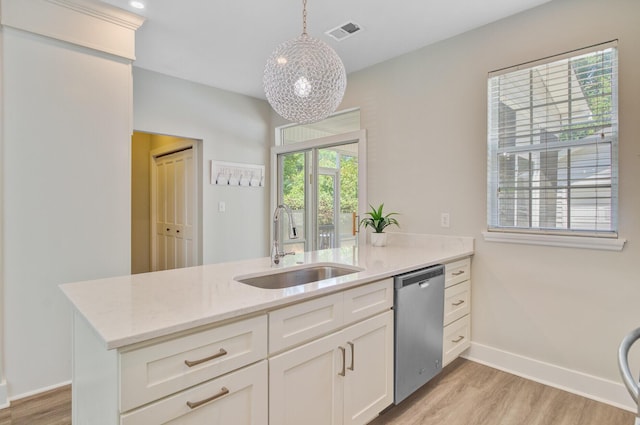 2404 Fulford Ct, Mount Pleasant, SC 29466 - kitchen featuring stainless steel dishwasher, light wood-style flooring, a peninsula, and white cabinetry
