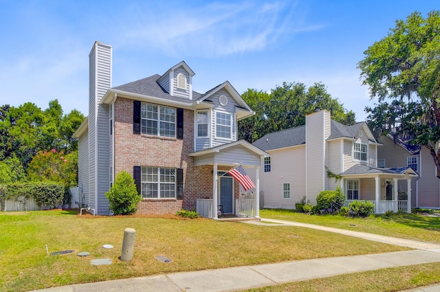 2404 Fulford Ct, Mount Pleasant, SC 29466 - traditional home with brick siding, a front lawn, and a chimney
