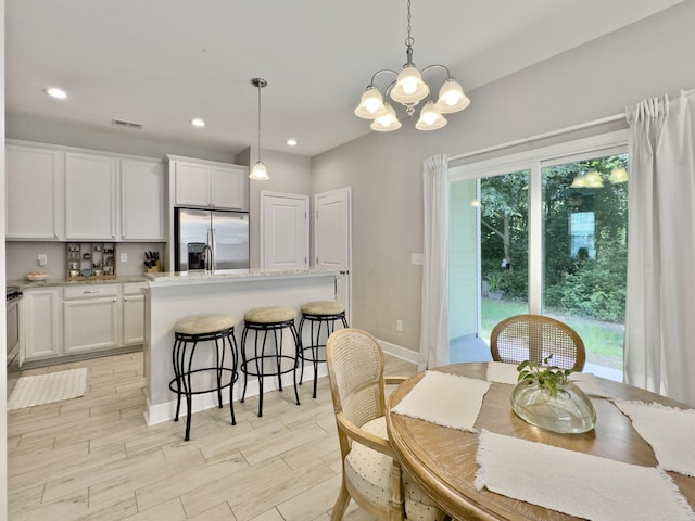 1069 Lexi Ct, Ladson, SC 29456 - dining room with a chandelier, recessed lighting, baseboards, and light wood-style flooring