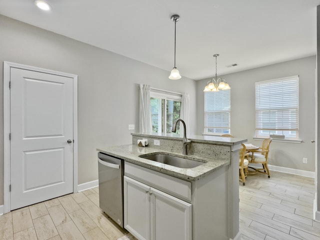 1069 Lexi Ct, Ladson, SC 29456 - kitchen featuring stainless steel dishwasher, a sink, baseboards, decorative light fixtures, and recessed lighting