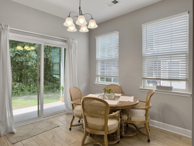 1069 Lexi Ct, Ladson, SC 29456 - dining room with plenty of natural light, a chandelier, and baseboards