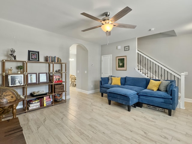 1069 Lexi Ct, Ladson, SC 29456 - living area with arched walkways, a ceiling fan, wood finished floors, and baseboards