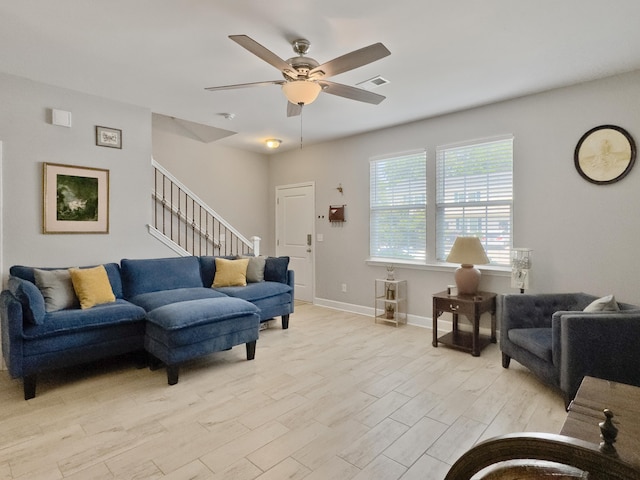 1069 Lexi Ct, Ladson, SC 29456 - living area with a ceiling fan, stairway, light wood finished floors, and baseboards