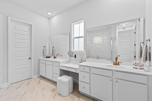 bathroom with a shower with door and vanity