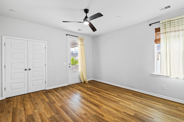 unfurnished bedroom with wood-type flooring and ceiling fan