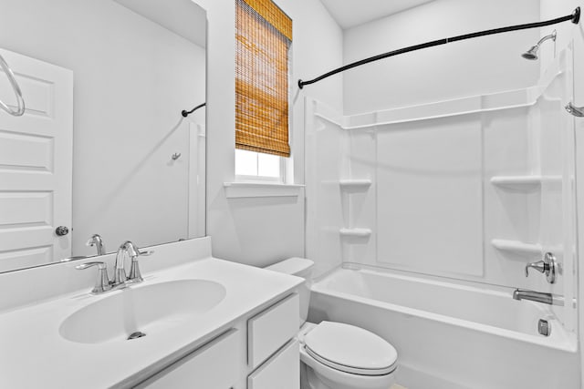 full bathroom with  shower combination, vanity, and toilet