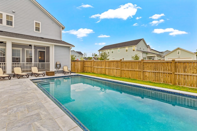 view of swimming pool with a patio area