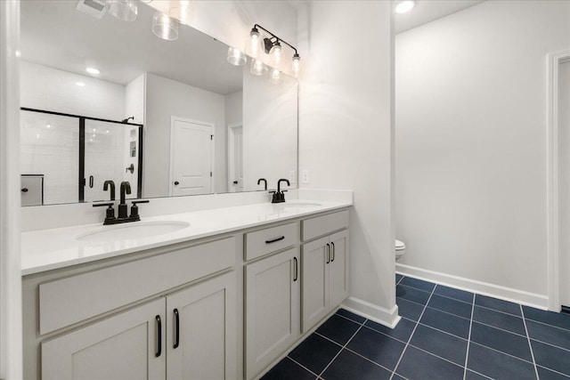 bathroom with tile patterned flooring, vanity, toilet, and an enclosed shower