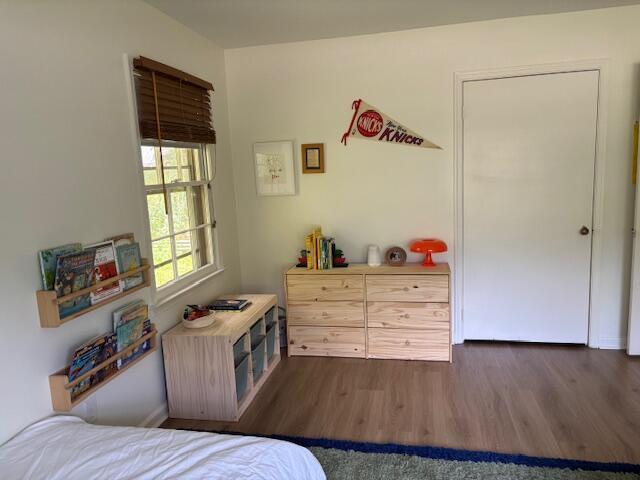 bedroom featuring wood finished floors