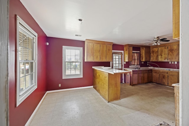2736 Bonds Ave, North Charleston, SC 29405 - kitchen featuring ceiling fan, kitchen peninsula, a breakfast bar, and sink