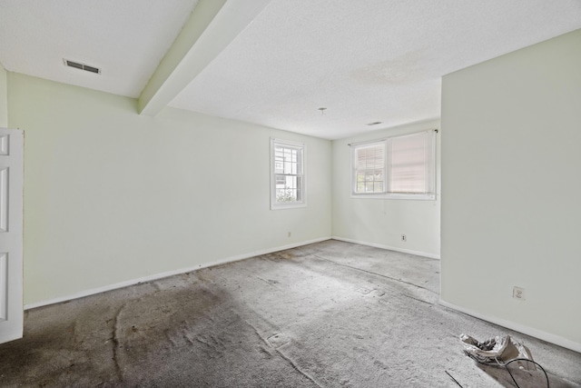 2736 Bonds Ave, North Charleston, SC 29405 - empty room featuring a textured ceiling and beam ceiling