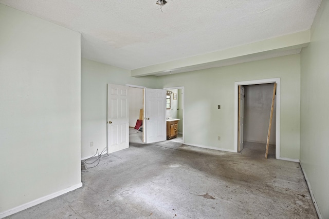 2736 Bonds Ave, North Charleston, SC 29405 - unfurnished bedroom with a textured ceiling, a closet, and ensuite bath