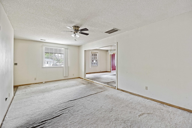 2736 Bonds Ave, North Charleston, SC 29405 - unfurnished room with light carpet, ceiling fan, and a textured ceiling