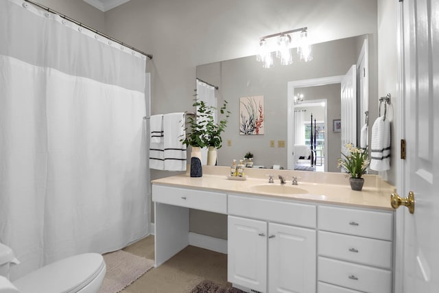 full bath with connected bathroom, toilet, vanity, and an inviting chandelier