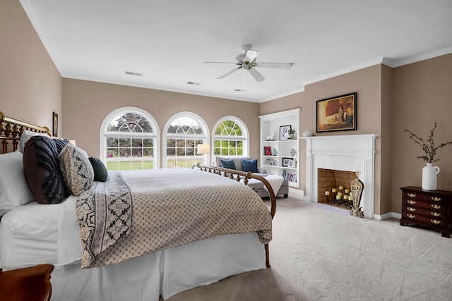 carpeted bedroom featuring baseboards, a ceiling fan, visible vents, and crown molding
