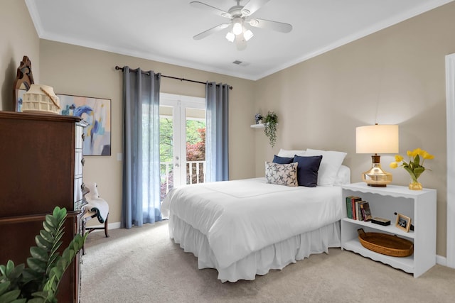 bedroom with light carpet, visible vents, crown molding, and access to outside