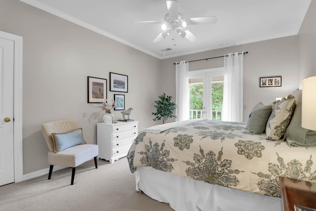 carpeted bedroom featuring baseboards, ornamental molding, and a ceiling fan