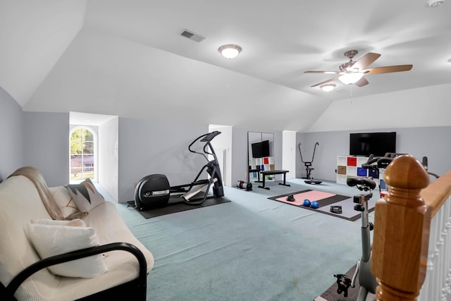 exercise area featuring lofted ceiling, ceiling fan, visible vents, and carpet floors
