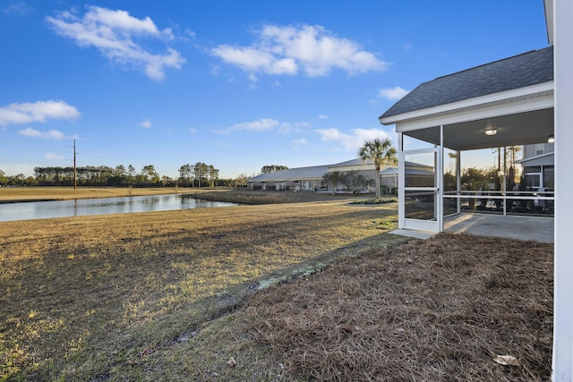 view of yard featuring a patio area and a water view