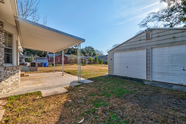 view of yard with a garage and an outdoor structure