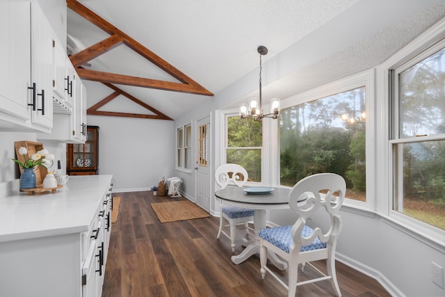 dining room with dark hardwood / wood-style flooring, lofted ceiling with beams, and an inviting chandelier