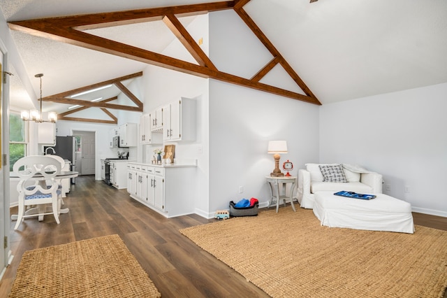 bedroom with beam ceiling, stainless steel refrigerator, an inviting chandelier, high vaulted ceiling, and dark hardwood / wood-style floors