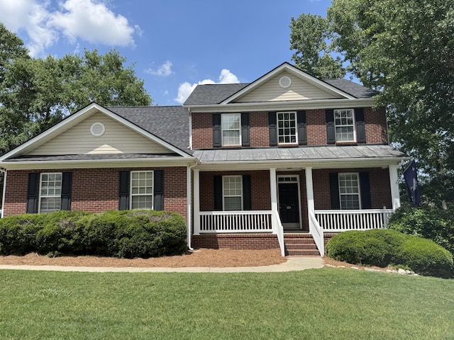101 Cobblers Glen Ct, Lexington, SC 29072 - view of front of home featuring roof with shingles, covered porch, a front lawn, and brick siding