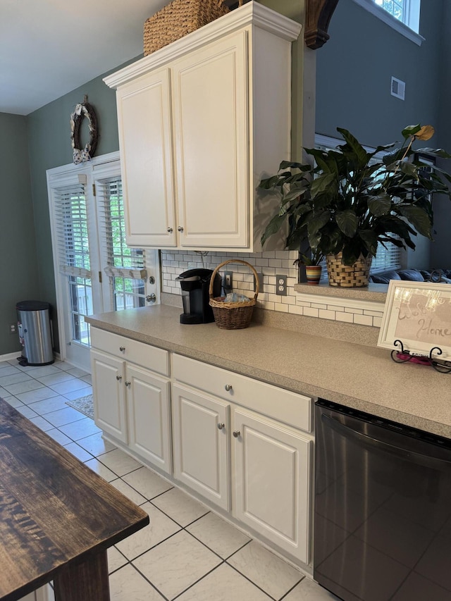 101 Cobblers Glen Ct, Lexington, SC 29072 - kitchen with tasteful backsplash, light tile patterned floors, light countertops, white cabinets, and dishwashing machine