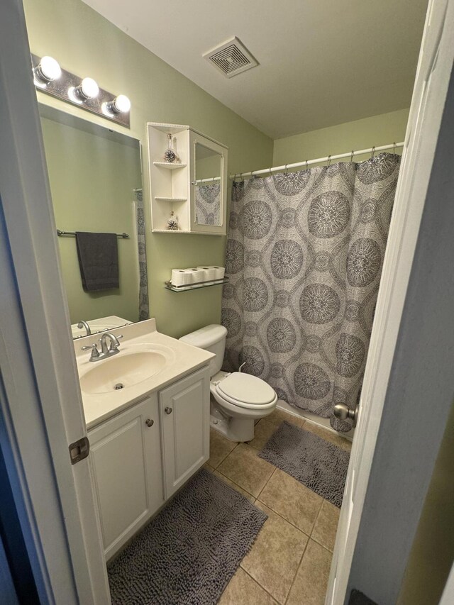 101 Cobblers Glen Ct, Lexington, SC 29072 - bathroom featuring a shower with curtain, visible vents, tile patterned flooring, vanity, and toilet