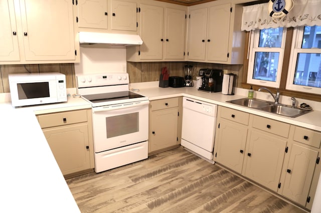 kitchen with white cabinets, white appliances, sink, and light wood-type flooring