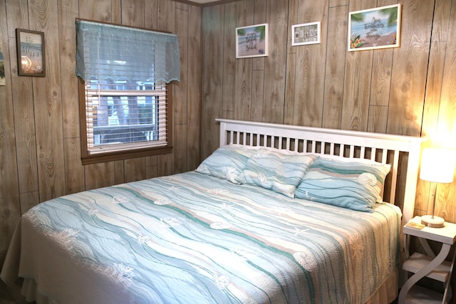 bedroom with wooden walls