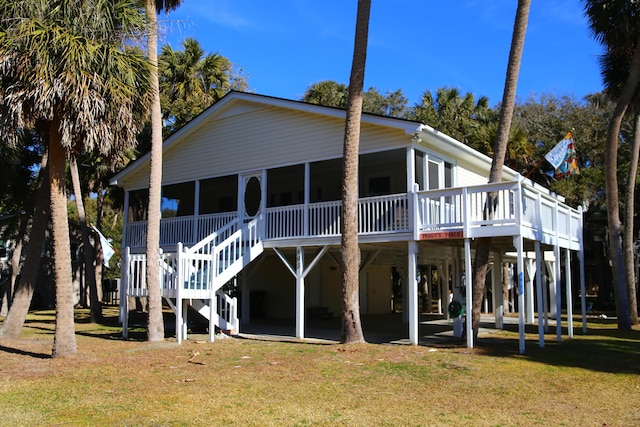 rear view of property with a yard