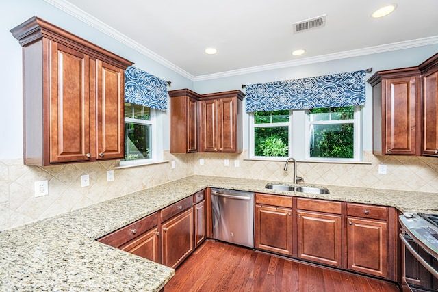 1253 Dingle Rd, Mount Pleasant, SC 29466 - kitchen with stainless steel appliances, dark wood-type flooring, plenty of natural light, light stone countertops, and crown molding