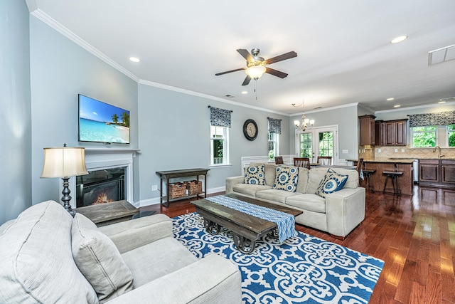 1253 Dingle Rd, Mount Pleasant, SC 29466 - living area with dark wood-type flooring, ceiling fan, a chandelier, recessed lighting, and ornamental molding