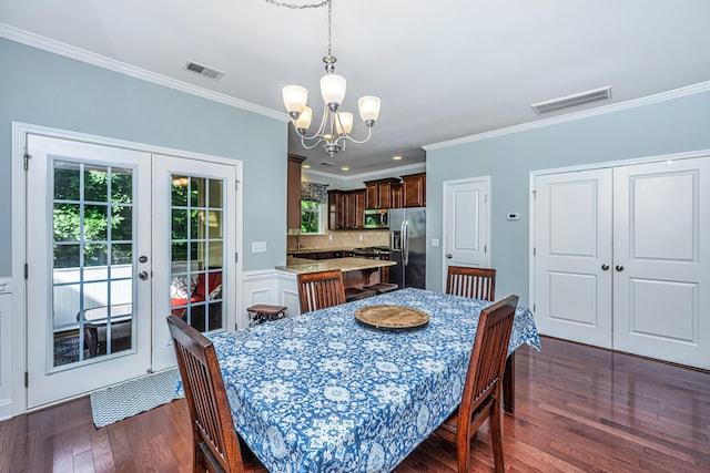 1253 Dingle Rd, Mount Pleasant, SC 29466 - dining room with a chandelier, crown molding, dark wood finished floors, and french doors