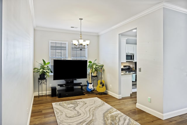 living room with ornamental molding, dark wood-type flooring, and an inviting chandelier