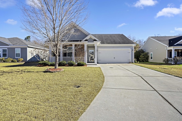 view of front of property with a front yard and a garage