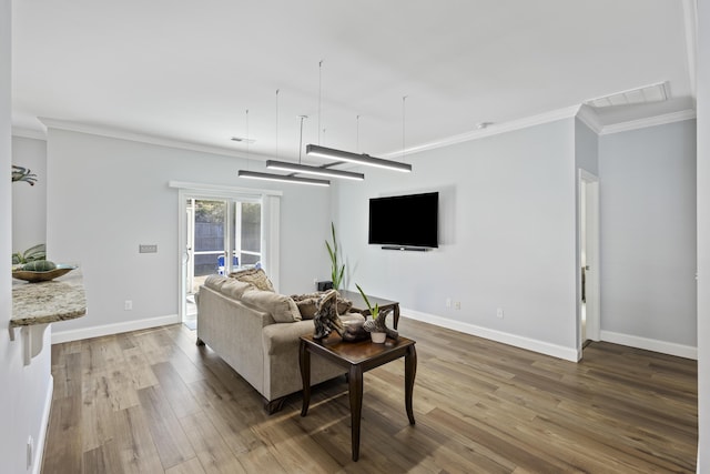 living room featuring hardwood / wood-style flooring and ornamental molding