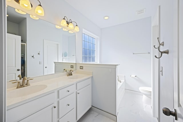 full bathroom featuring separate shower and tub, vanity, and toilet