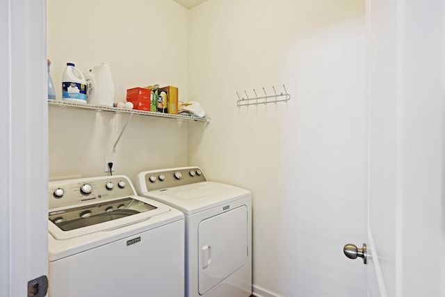 laundry area with washing machine and dryer