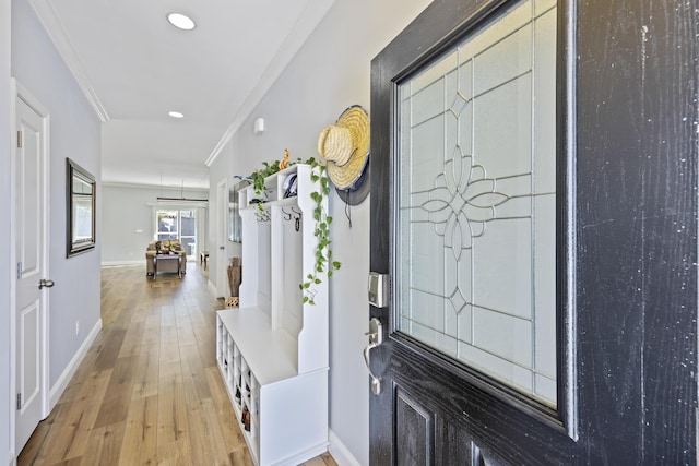 interior space with hardwood / wood-style floors and crown molding