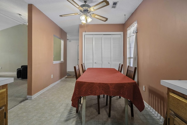 dining room with ceiling fan