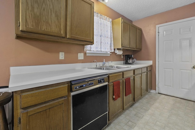 kitchen featuring sink, a textured ceiling, and black dishwasher